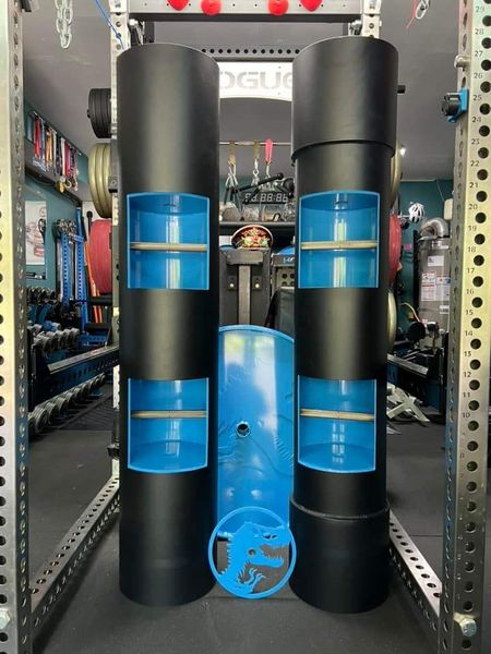 Black and blue training equipment stands in a gym